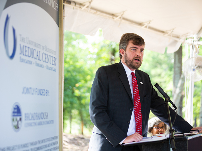 Dr. Damon Darsey, associate professor of emergency medicine and medical director of the Mississippi Center for Emergency Services, explains the center's mission during groundbreaking ceremonies.